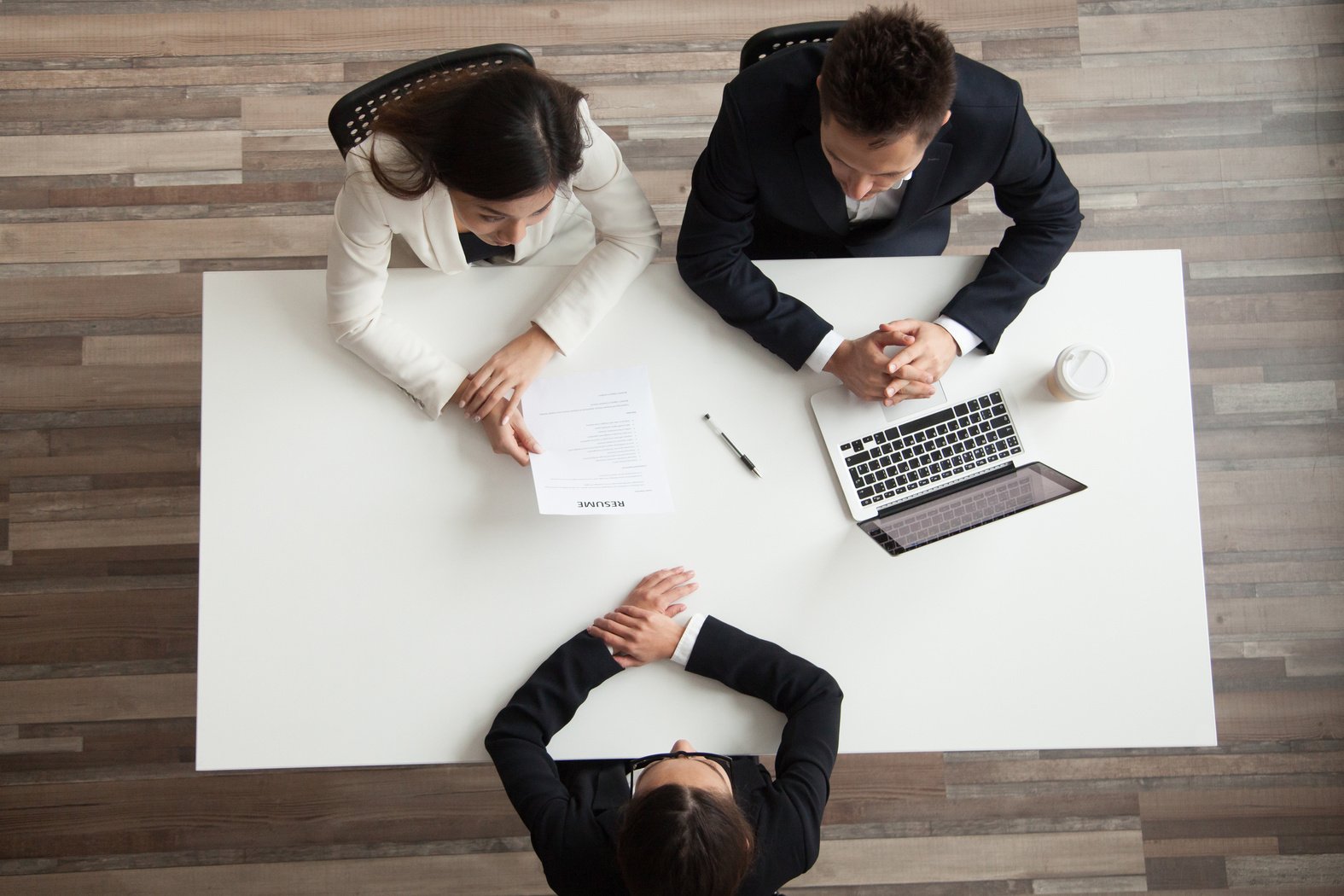Hr managers interviewing female job applicant, top view from above